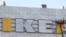 Workers take down an Ikea sign from the Aviapark shopping mall